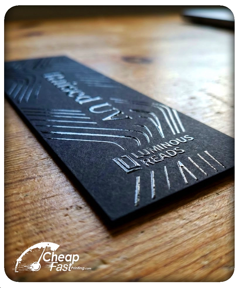 Macro close-up of 3D raised UV spot gloss texture on a premium print piece