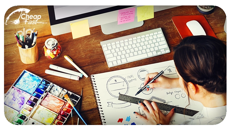 Graphic designer working on marketing material layout