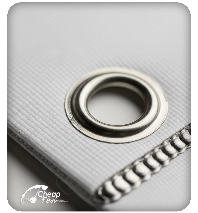 Close-up of heat-welded hems and nickel-plated grommets for weather-resistant signage