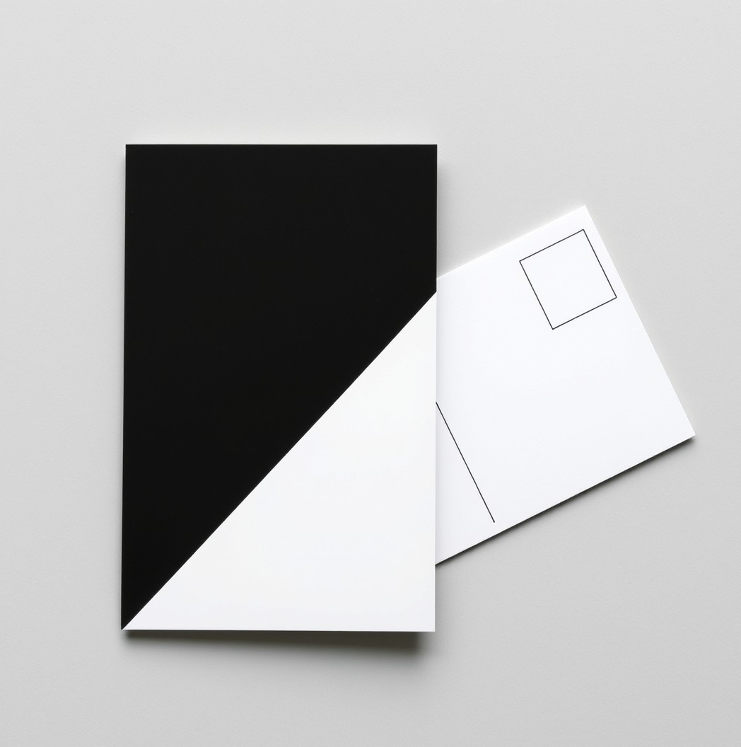 Front To Back Copy Balance On Postcards: The Postcard Copy Formula That Converts Better: a glossy postcard and a matte postcard placed side by side.